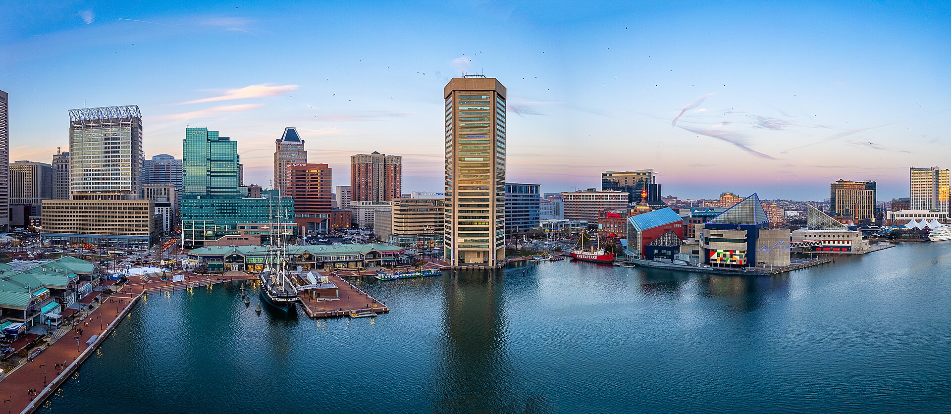 Baltimore Inner Harbor and its waterfront skyline at dusk, Maryland.